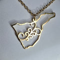 Collar Tenerife argolla canaria símbolo 8 espirales gold-tone necklace with intricate spiral design on map pendant