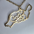 Collar Lanzarote argolla canaria símbolo 8 espirales gold-tone pendant with intricate spiral design on chain