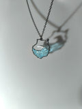 Collar con isla de Gran Canaria y olas en efecto tridimensional