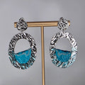pendientes de acero con olas artesanales plateado leche machanga creations